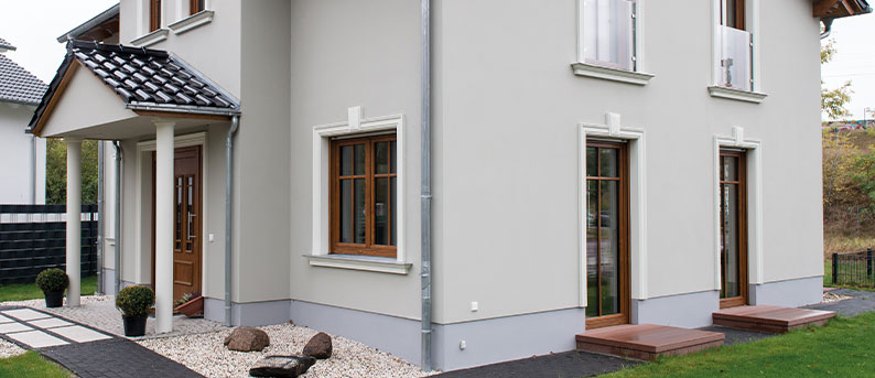 Classic façade design with exterior mouldings Exterior view of house with façade profiles and stucco mouldings